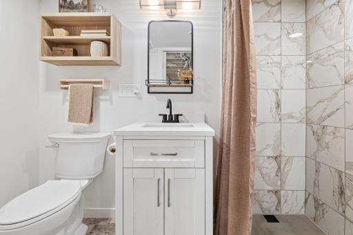 Lower level bathroom with a good sized shower