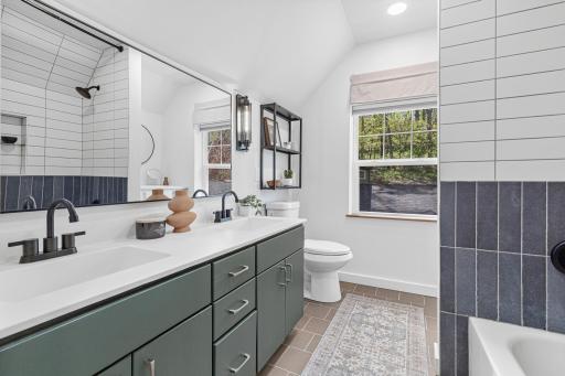 Vaulted Upper level Primary Suite with double sinks, bath, separate get ready nook