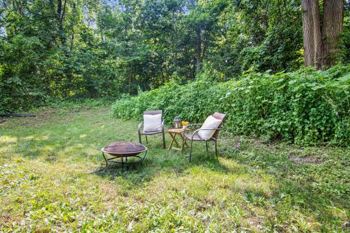 More photos of the back yard off the upper level of the garage, very mature landscaping to feel like you're further away from the cities