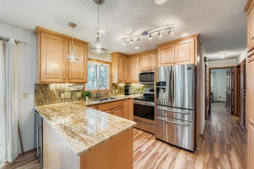 New cabinets, countertops, touch free sink and lighting