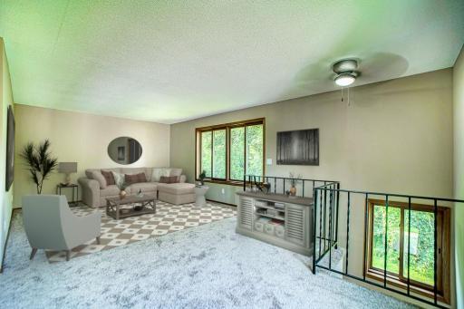 Light and airy space with a view to the private backyard. A lot of light flooding the space-bringing the outdoors-in.
New Carpet, paint, lighting and fan