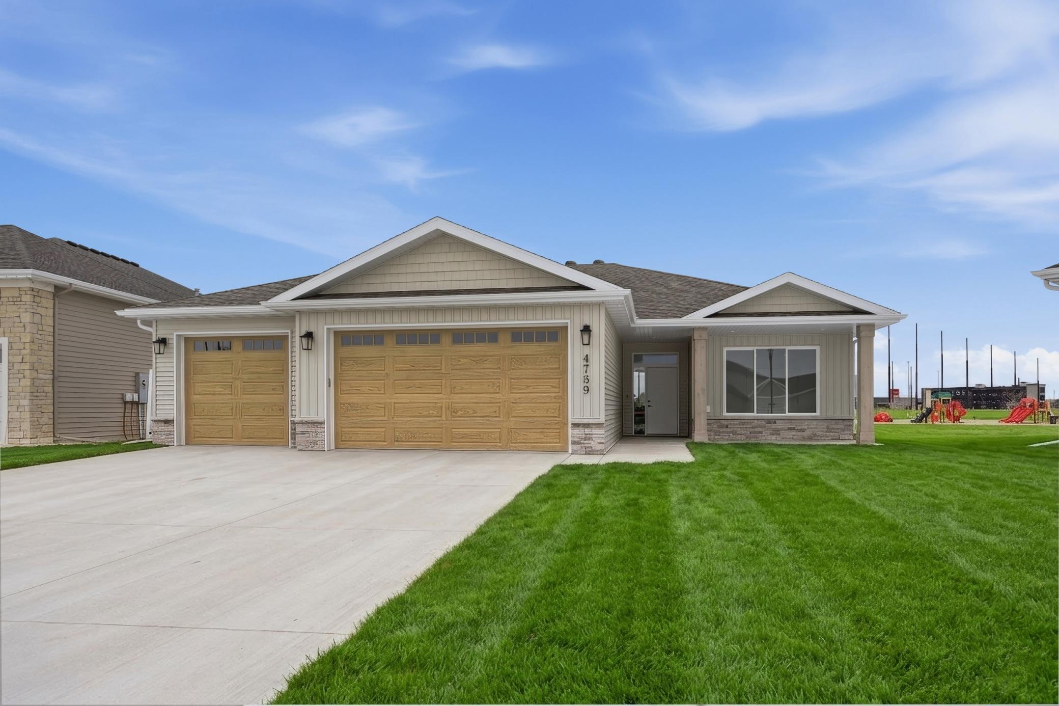 4759 32nd St S - Slab on Grade Model Home **yard not included, grass added in photo
