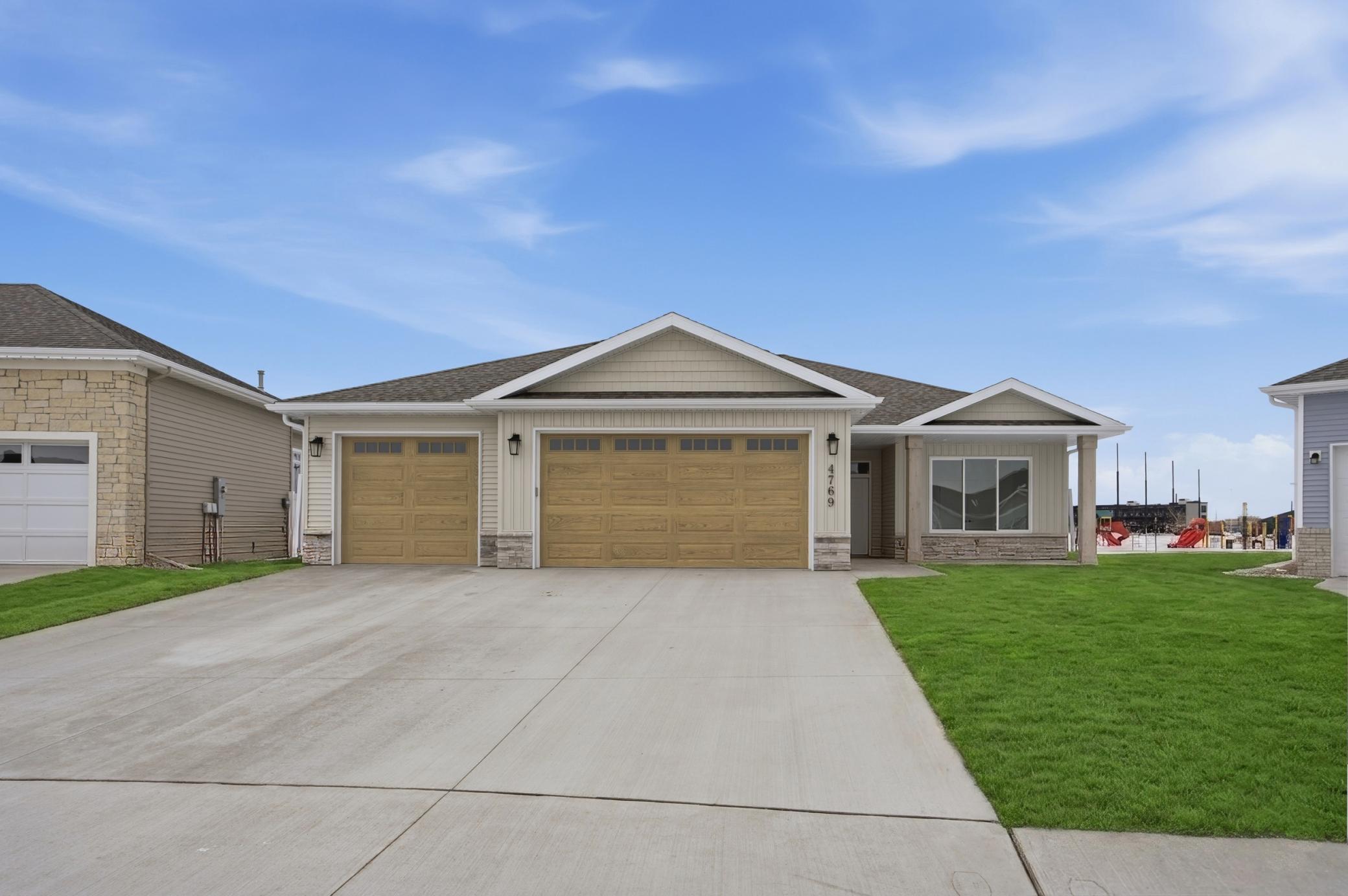 4759 32nd St S - Slab on Grade Model Home **yard not included, grass added in photo