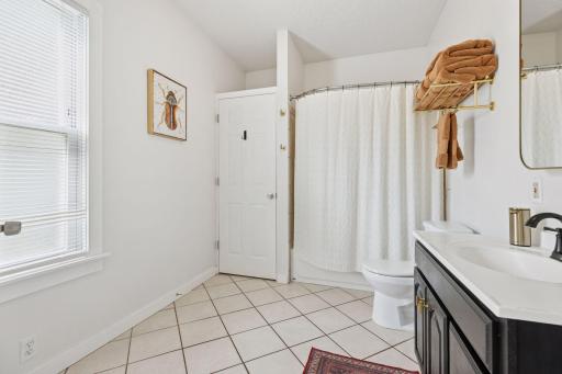 Main floor, spacious full bathroom with linen closet