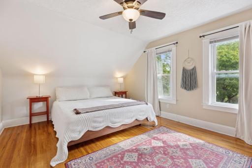 Spacious and bright primary bedroom on upper level