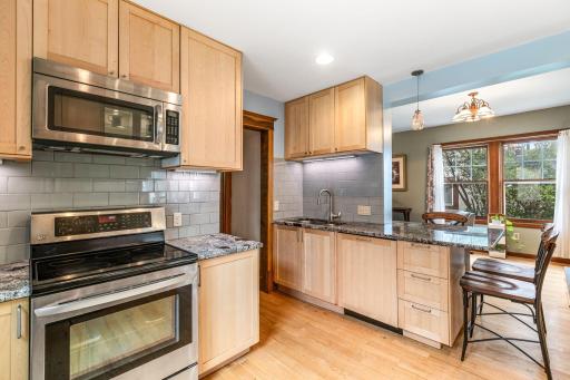 Gorgeous kitchen features subway tile backsplash tons of storage space, and a double sink