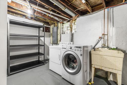 Huge laundry and utility area with room for storage, folding space, and organization