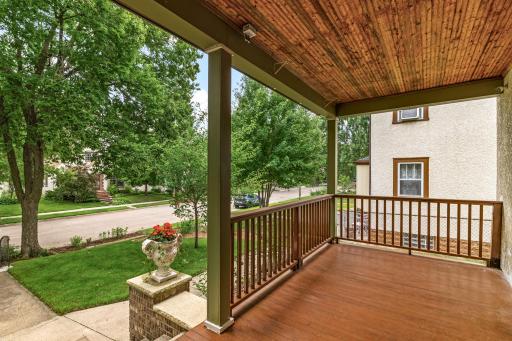 Inviting wrap-around walkway and porch create a perfect space to relax and enjoy the neighborhood