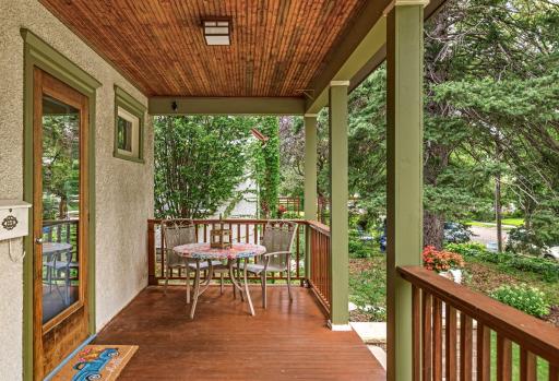 Spacious front porch with wood ceiling and ample room for seating or seasonal dÃ©cor