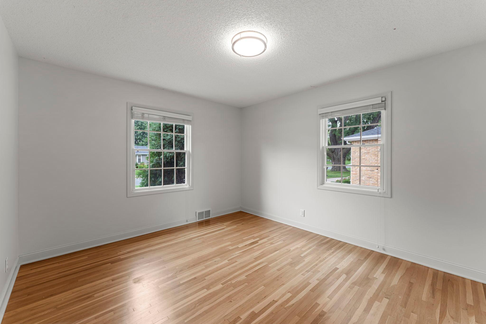 Plenty of natural light and timeless wood flooring in both bedrooms.