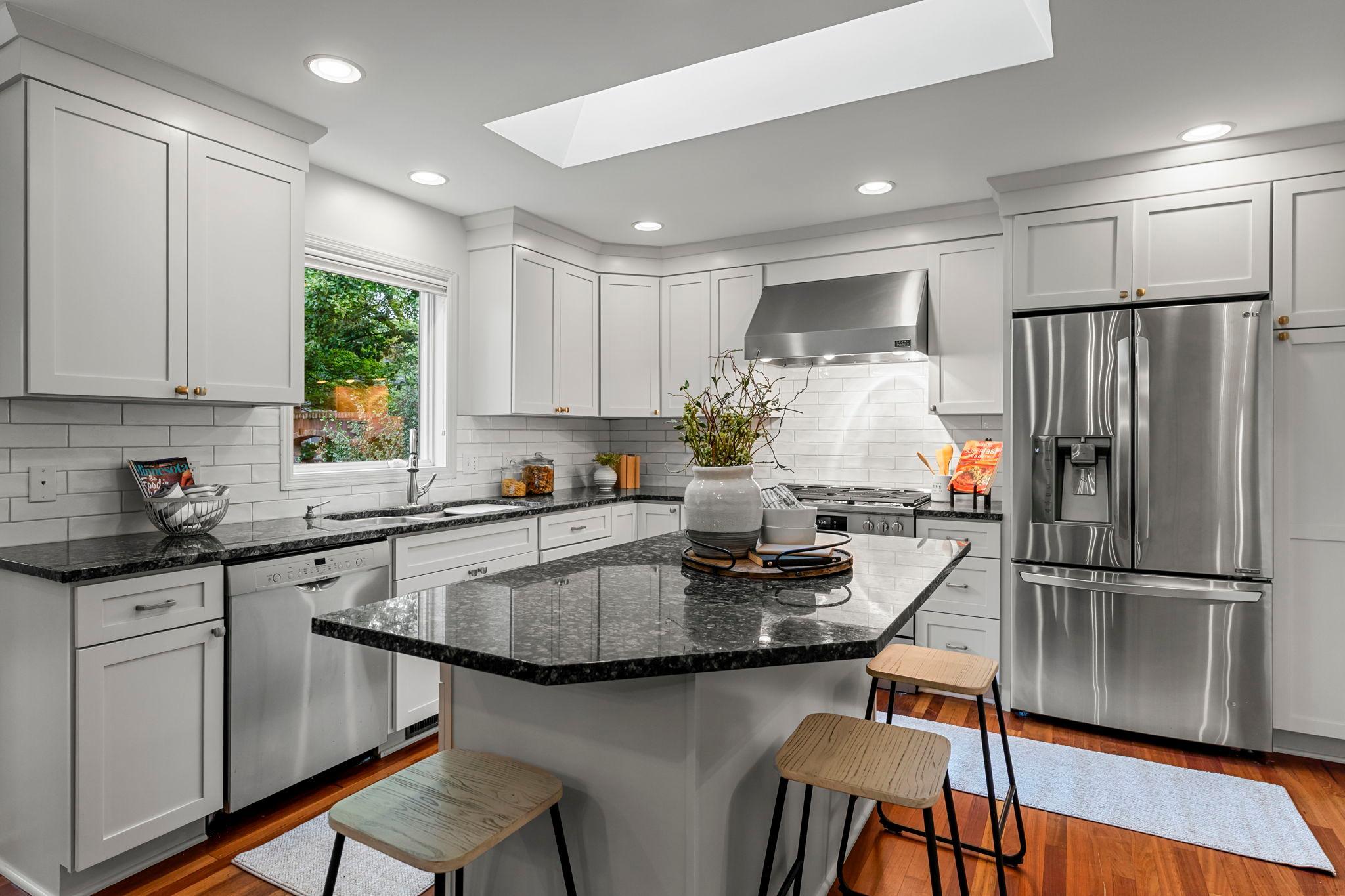 The kitchen is equally impressive with stainless steel appliances, including a brand-new range.