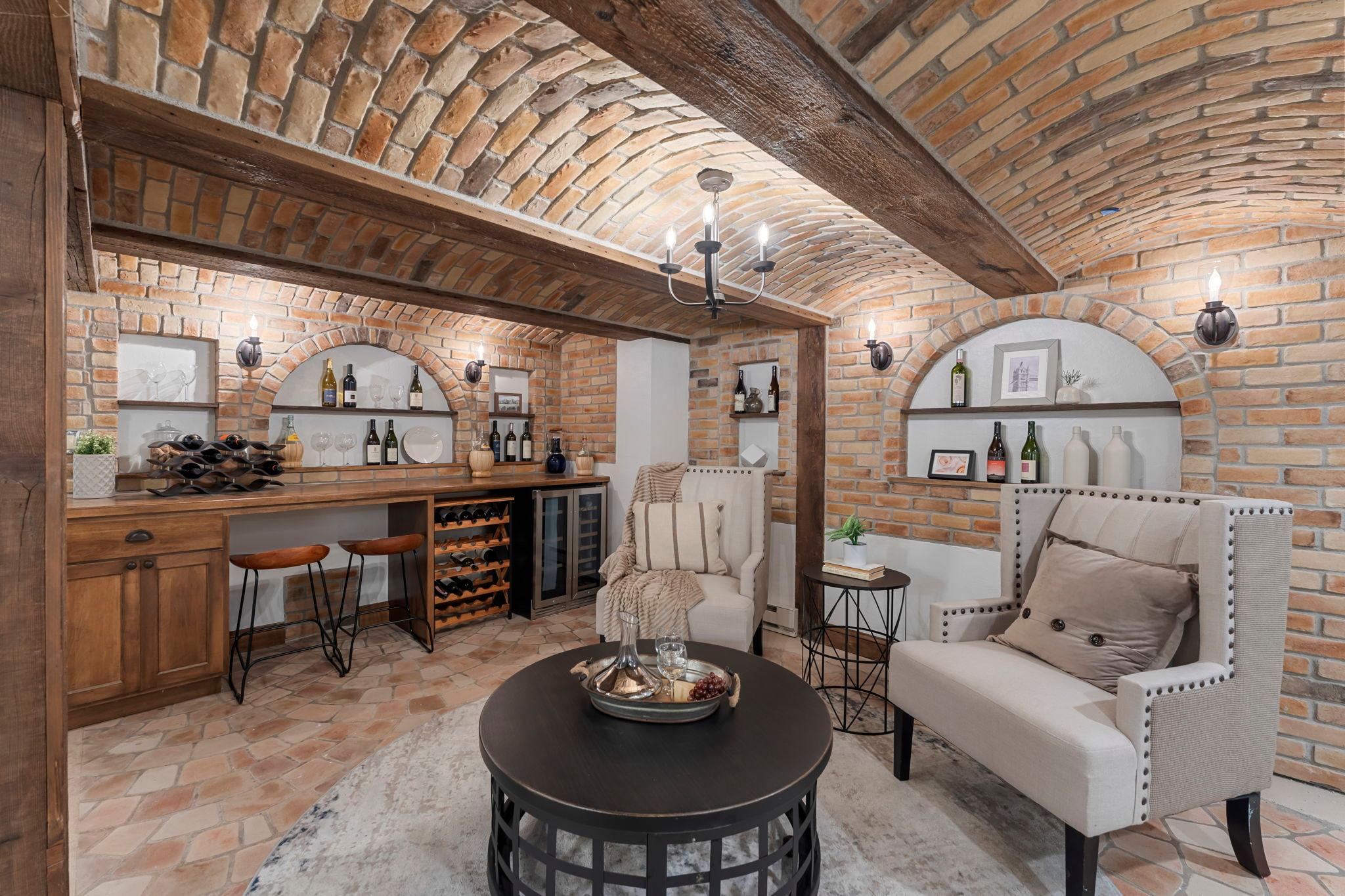 The lower level is a true showpiece, anchored by a custom-designed bar inspired by an Italian villa.