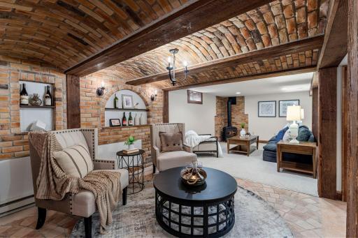 Warm wood counters, rustic beams, stone detailing, curved ceilings, and a chandelier to set the mood.