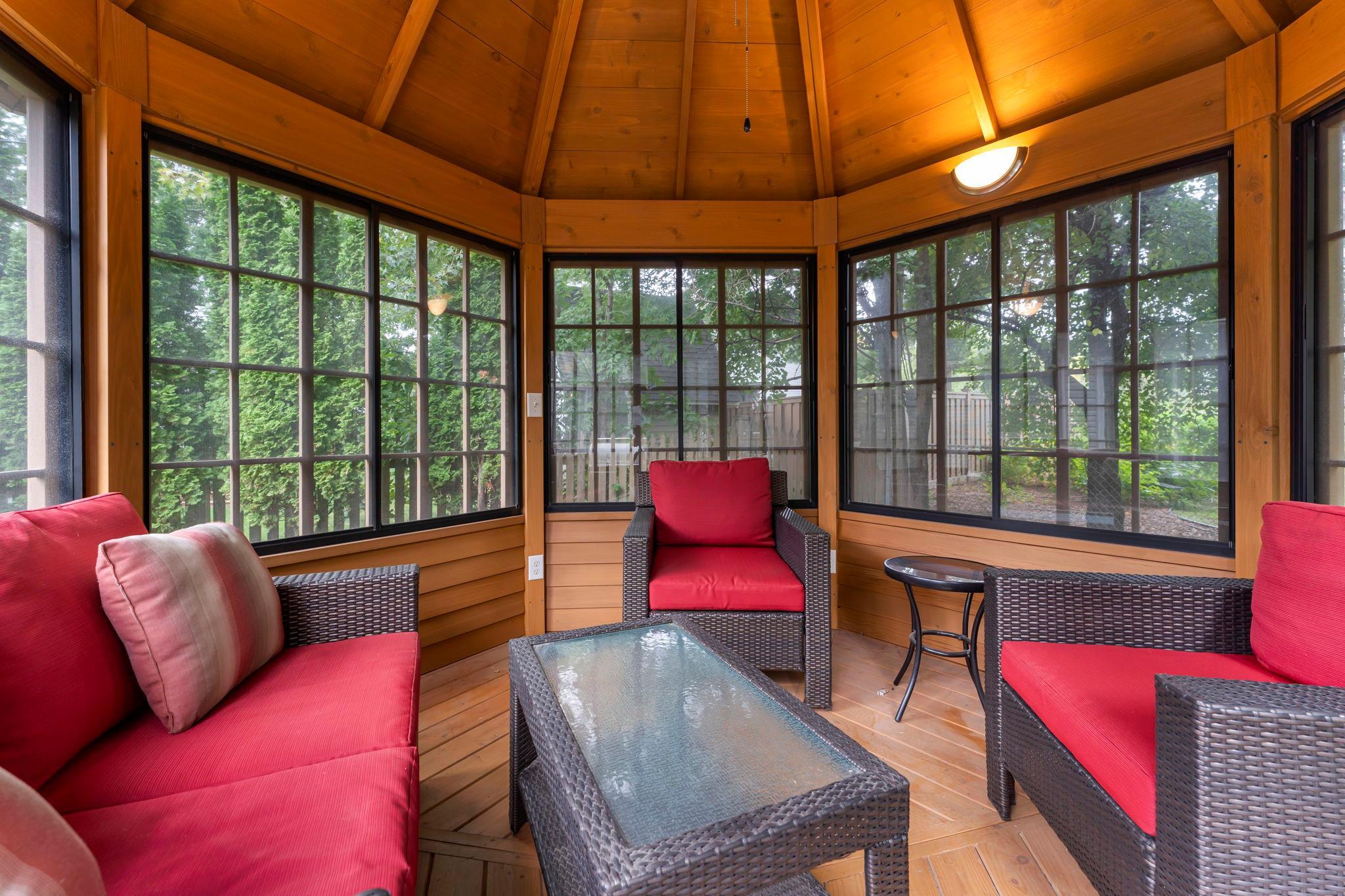 A three-season gazebo offers a peaceful retreat.