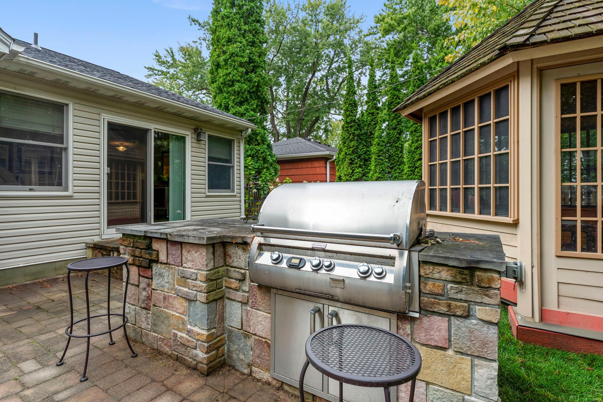Included is a gas grill station, with a built-in stone table close by.