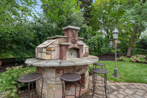 This outdoor space is an entertainerâs dream, featuring a built-in stone pizza and bread oven (with all tools included).