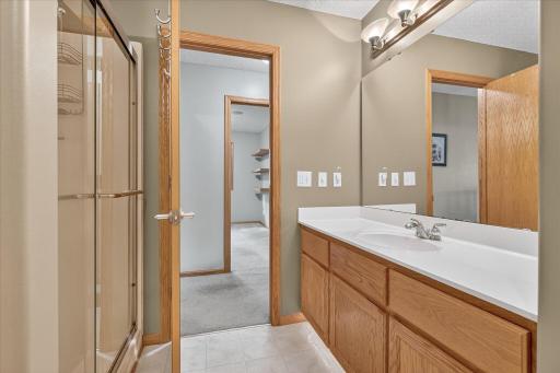 Main living level full bathroom with separate bathtub and shower.