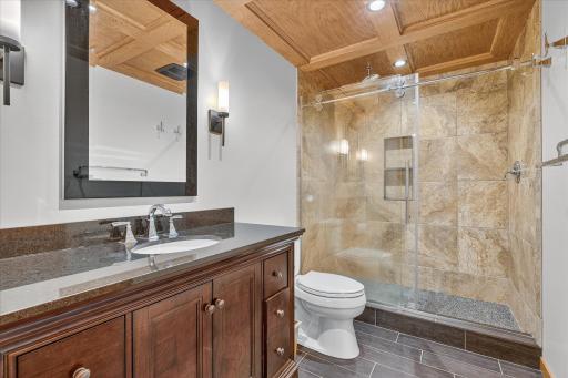 Lower level 3/4 bathroom with heated floors. Beautiful tiled, step in shower.