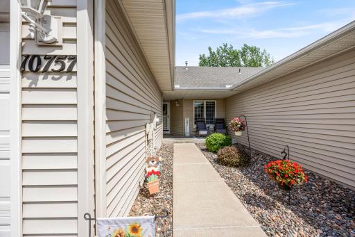 Enjoy a private front porch to sit at and enjoy. This home has great outdoor space!