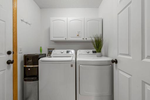 The main level laundry features a 2020 washer and dryer, and storage above.