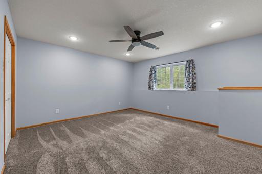 This large 3rd bedroom has practically brand new carpet and plenty of lighting.