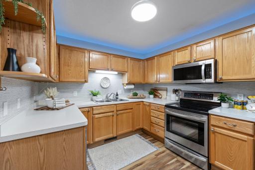 The kitchen has plenty of counter and cabinet space with another solar tub and upper cabinet lighting for plenty of light!