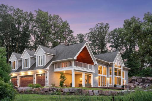 Exquisite 4-bed, 3-bath, 4,300+ sq ft retreat at the end of a private cul-de-sac, boasting over 150 feet of pristine lakeshore.