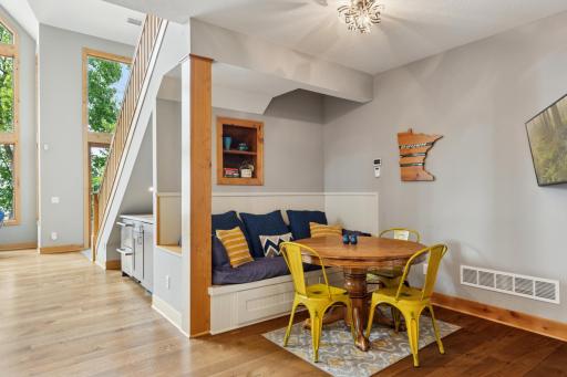 Charming built-in breakfast nook offers the perfect cozy corner for morning coffee, casual meals, or game nightâthoughtfully tucked beside the wet bar.