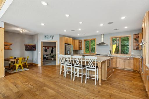 View from the kitchen looking toward the mudroom and garage entranceâperfectly positioned for unloading groceries or managing busy routines with ease and efficiency.