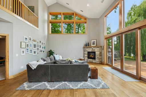 Cozy up by the gas-burning fireplace in the heart of the great roomâsurrounded by soaring ceilings, warm wood accents, and floor-to-ceiling windows that frame peaceful lake views.