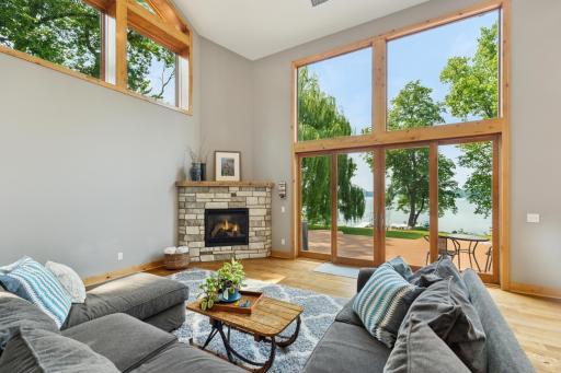 Unwind fireside while taking in panoramic lake views through a wall of windows.