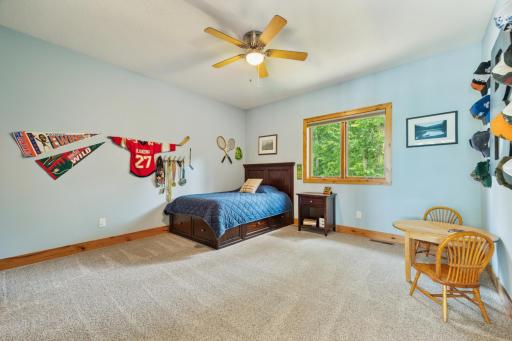 One of the other three generously sized upper-level bedroomsâbright, inviting, and perfect for personalization.