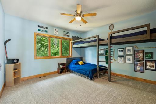 Another spacious upper-level bedroomâoffering serene wooded views and plenty of space for bunk beds or creative setups.