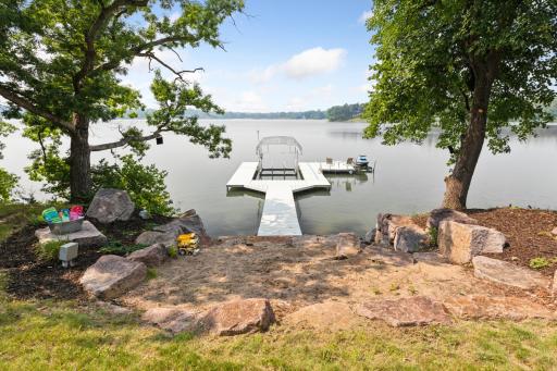 Tucked between mature trees and boulders, this private beach area offers the perfect spot for lakeside play and relaxationâjust steps from your dock.