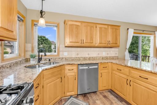 Many Cabinets with double kitchen window.