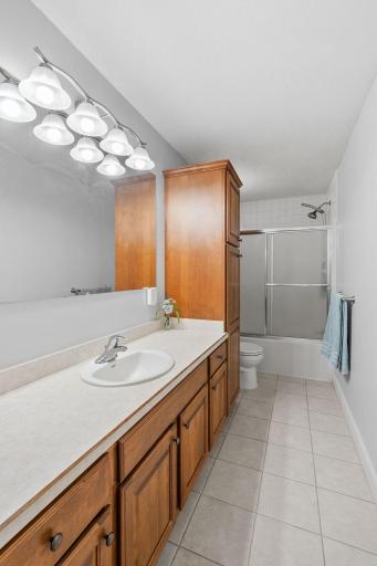 Upper level full bathroom with extra large vanity.