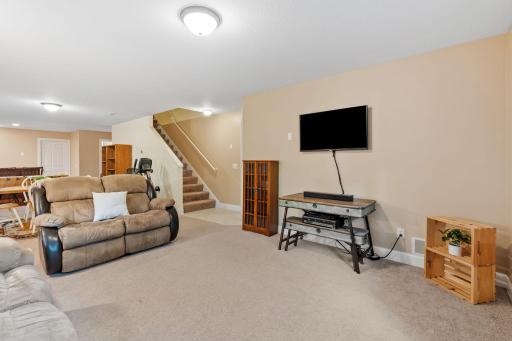 The fully finished lower level expands your living space with a large bedroom, a 3/4 bathroom, a wet bar for entertaining, and a walk-out to the back patioâmaking it an ideal setup for multi-generational living or guests.