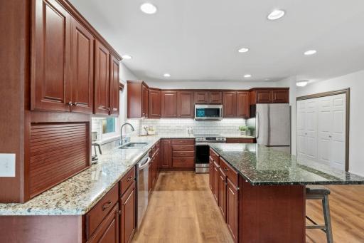 Ample storage space and a large kitchen island make meal prep easy!
