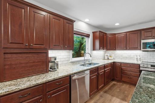 Beautiful tile backsplash adds a touch of charm in the kitchen.