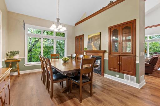 Enter the home into your beautiful private dining room with 2-sided fireplace, large windows and built-in storage.
