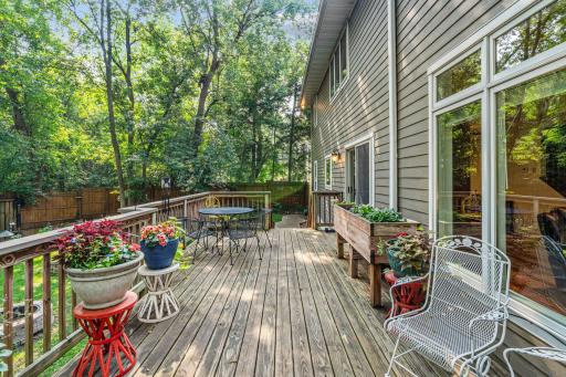 Outside, enjoy a spacious deck overlooking a beautifully landscaped, private backyard
