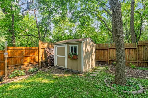 The shed is perfect storage for all of your yard tools.
