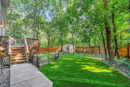 This gated area with turf at the top of the yard is perfect for small dogs!
