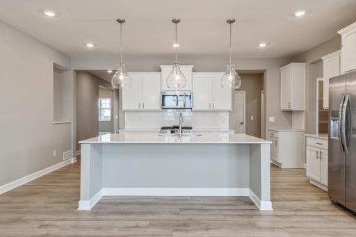 (Photo of a similar home, actual home's finishes will vary slightly) Imagine preparing a wonderful meal in this kitchen or entertaining friends and family over the weekend!