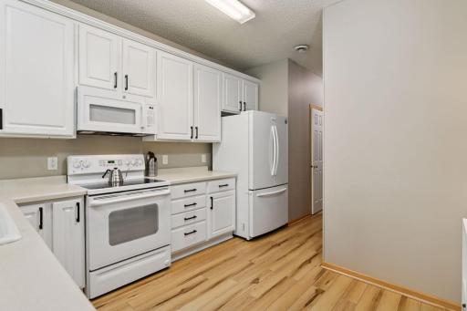 Large kitchen with abundant cabinetry and storage space galore.