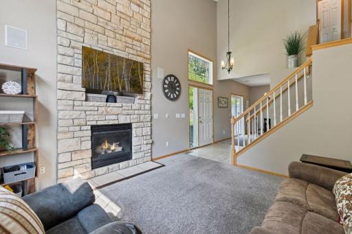 Dramatic floor to ceiling stone, gas burning, fireplace.