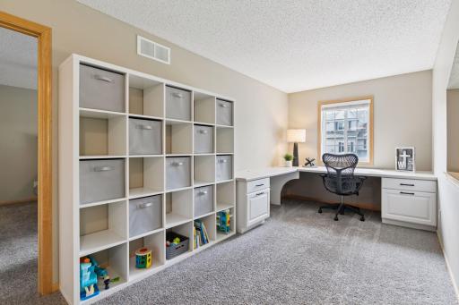 Upper level loft with a built-in desk, a perfect work from home space.