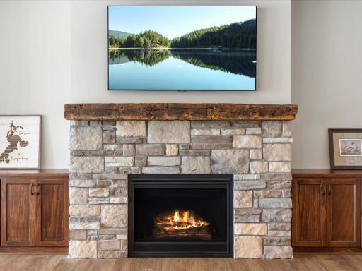 Stone fireplace and authentic barn wood mantle complete with built-ins on each side.