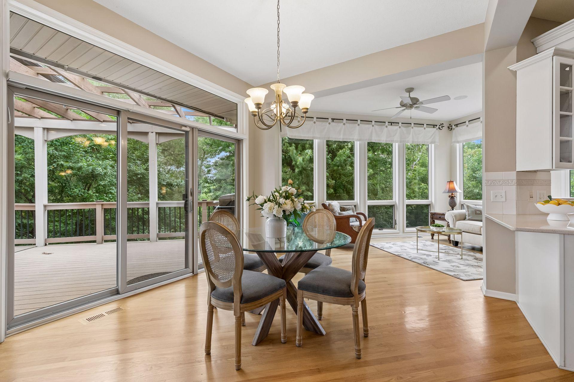 Informal dining room off kitchen leads to massive deck