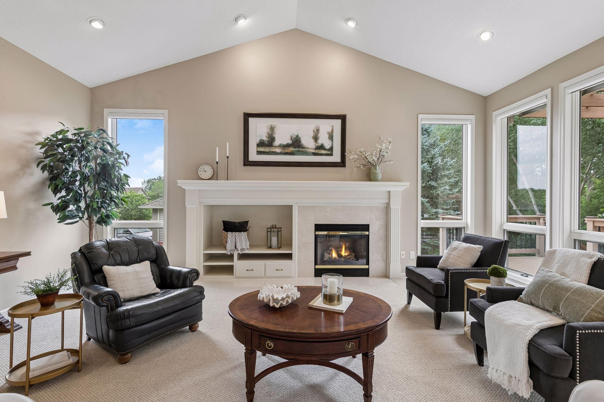 Vaulted great room with built-ins and fireplace. All new fireplace mechanicals 2025